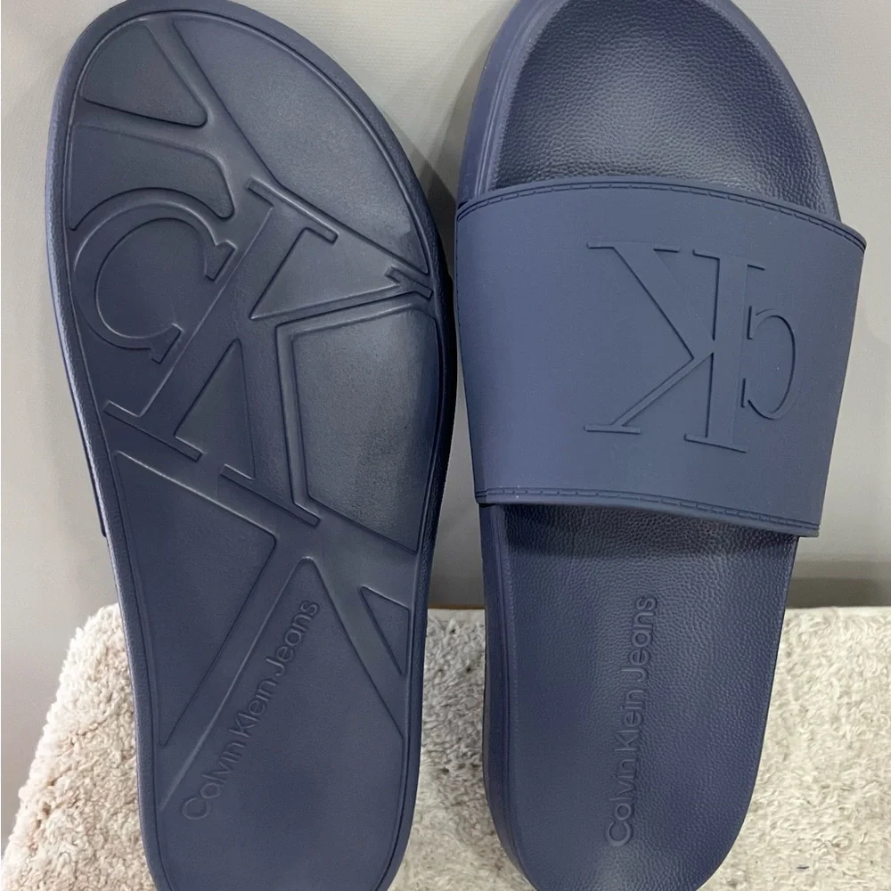 Calvin Klein Medium Gray Embossed CK‎ Slide Sandals